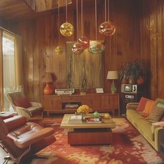 a living room filled with lots of furniture next to a wooden wall covered in hanging lights