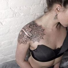 a woman with a tattoo on her chest