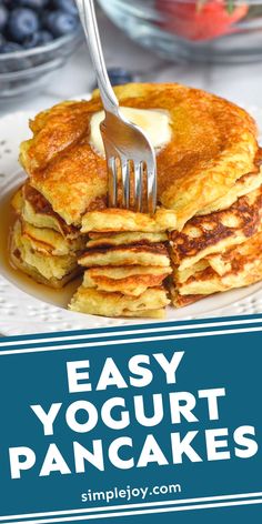 a stack of pancakes with butter on top and blueberries in the background text reads easy yogurt pancakes