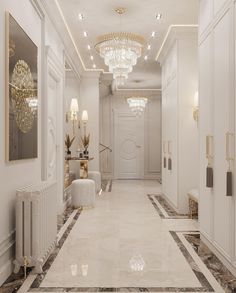 an elegant hallway with chandeliers and white walls