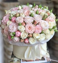 a large bouquet of pink and white roses