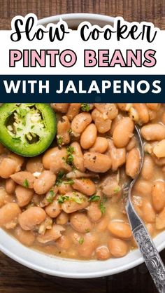 slow cooker pinto beans with jalapenos in a white bowl on a wooden table