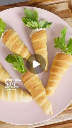 croissants on a plate with parsley in the middle and green leaves