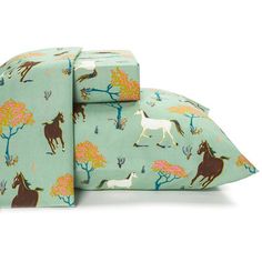 two sheets with horses and trees on them, one is light blue the other is brown