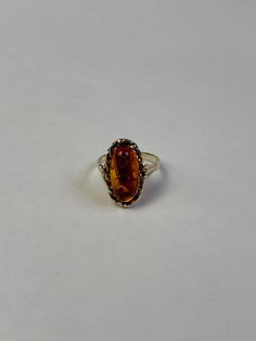 Beautiful amber women's ring made of 333 8 carat gold with oval amber and curved setting. Ring size: 54 (approx. 17.2 mm inner diameter) Ring band: approx. 2 mm - 4 mm wide Ring crown: approx. 1.9 cm x 1.2 cm Fineness: 333 8 carat gold Weight: approx. 2.99g This is tested real gold. All real gold rings can be enlarged or reduced in size by goldsmiths for little money. Green Amber Ring, Amber Engagement Rings, Amber Ring Engagement, Amber Engagement Ring, Real Gold Rings, Ring Crown, Wide Ring, Amber Ring, Crown Ring