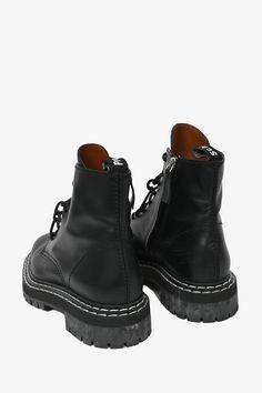 Proenza Schouler Black Leather Lace-Up Combat Boots. Tie-up closure. Round toe. Contrast stitching. Original Retail Price: $1165Size: 41 (11 US)Colour: BlackCondition: This item is in good pre-loved condition with signs of wear on soles, bottoms and some scratches to leather. Mens Spring Shoes, Pop Clothing, Louis Vuitton Shop, Lace Up Combat Boots, Iconic Bags, Heeled Loafers, Spring Shoes, Leather Lace, Proenza Schouler