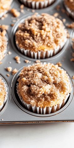 muffins with crumbs sitting in a baking pan