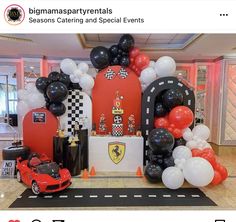 a car themed birthday party with balloons and decorations