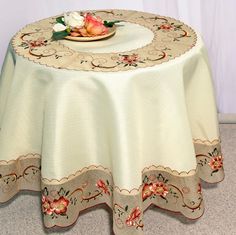 a white table cloth with flowers on it