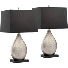 two gray lamps with black shades on them