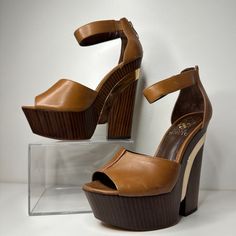 Brand New Vince Camuto Bailor Wedge In Fudge Brown. Shoe Box Not Included. Gleaming Metal Lends Sculptural Intrigue To An Ankle-Strap Wedge In Triple Neutral Hues. Back Zip Closure. Approx. Heel Height: 5" With A 2" Platform (Comparable To A 3" Heel). Leather Upper/Synthetic Lining And Sole. By Vince Camuto; Imported. Women's Shoes. Shoe Goals, Shoes Game, Beautiful Heels, Stunning Shoes, Strap Wedge, Ankle Strap Wedges, Gorgeous Shoes, Shoe Closet, Vince Camuto Shoes