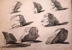 several rocks are shown in black and white ink on a piece of paper with some writing underneath them