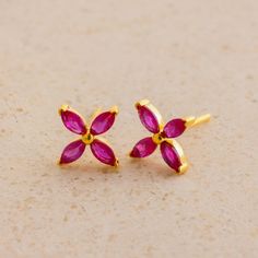 Introducing our Birthstone Flower Studs, featuring marquise-cut gemstones arranged in a delicate floral pattern. Perfect for sunny day picnic or a casual brunch, these dainty studs add a touch of nature-inspired beauty to any look. Personalize with your birthstone and bloom into elegance with these charming earrings. SKU: MM-CM76 Product Details Material: High Quality Solid 925 Sterling Silver Finish: Sterling Silver ∙ 18K Gold ∙ Rose Gold Featuring dainty Flower Stud Earrings with a ~3.5x2mm Ma Gemstone Flower Earrings, Marquise Diamond Earrings, Ivy Flower, August Baby, Birthstone Colors, Mom Wedding, Dainty Studs, Flower Stud Earrings, Summer Gifts