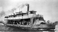 a large boat with people on it in the water