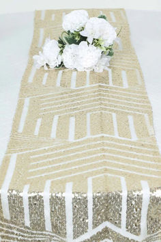 Transform your event into a luxurious affair with the Geometric Lines Sequin Table Runner. This stunning table runner is designed to elevate your decor and add a touch of elegance to any occasion. The sequin embellishments on a mesh base create a mesmerizing effect, making it a perfect choice for weddings, parties, and other special events. Geometric Lines