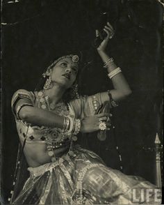 an old black and white photo of a woman dancing