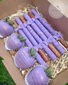 there are many purple desserts in the box