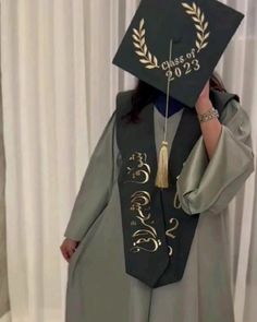 a woman wearing a graduation cap and gown