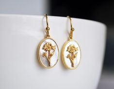 These lovely mother-of-pearl birth flower earrings would be a perfect gift for a Mom, Grandma, Aunt, friend, or any loved one. It's a perfect way to celebrate a family. You can select the same flowers for the set or two different ones and choose from gold-plated or gold-filled earring hooks. The 14k gold-plated birth flower pendant measures 10x14mm. HOW TO ORDER Please include the birth month(s) in the personalization section. MATCHING NECKLACE: Click here for the matching necklace. These earrin Birthday Earrings, Daisy May, Month Flowers, Birth Month Flowers, Birth Flower, Earring Hooks, Birth Month, Birth Flowers, Matching Necklaces