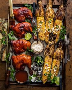 corn on the cob and grilled chicken with dipping sauces