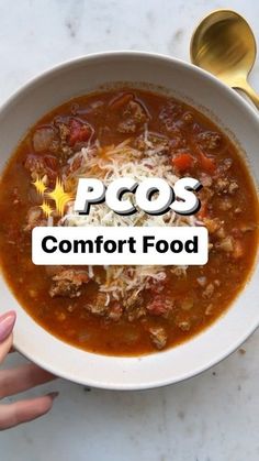 a bowl of soup with the words pos comfort food