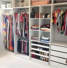 the closet is full of clothes and shoes