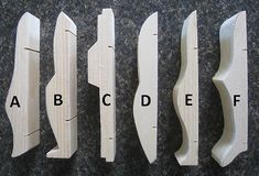 four different types of knife blades on a black surface with the words abcdef above them