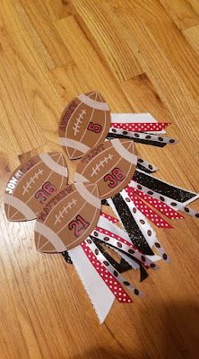 a football cut out on top of a wooden floor