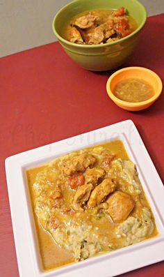 two bowls of food on a red table