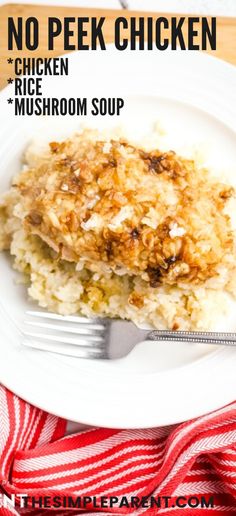 a white plate topped with chicken and rice covered in gravy next to a fork