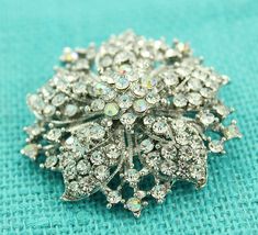 "Dazzling Vintage style crystal silver brooch jewelry embellishment, which can be used for your DIY project - Vintage theme wedding, bridal brooch bouquet, necklace, corsage, ring pillow, invitations, cake and frame decorations, , event decor, crafts, scrap booking and much more! Size: 2\"H x 2\"W Stone color: Crystal clear, iridescent. Metal: Silver plated More SILVER brooches - https://www.etsy.com/shop/Crystalitzy?section_id=16136267&ref=shopsection_leftnav_1 Please note that this crystal Wedding Crystal Brooches With Sparkling Stones, Silver Rhinestone Brooches For Wedding, Silver Wedding Brooches With Rhinestones, Wedding Silver Brooches With Sparkling Stones, Corsage Ring, Vintage Theme Wedding, Bling Cakes, Bridal Brooch, Bridal Brooch Bouquet