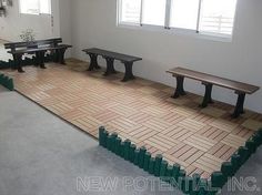 an empty room with benches on the floor