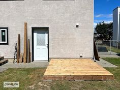 a house with a wooden deck in front of it