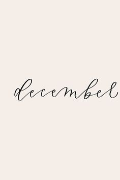 the word december written in cursive writing on a white background with black ink