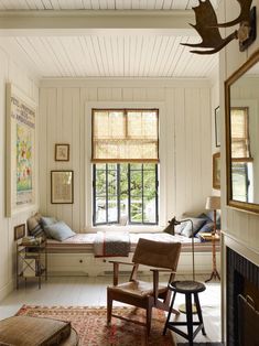 a room with white walls and wood floors