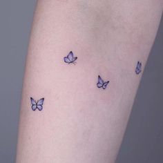 small blue butterflies tattoo on the arm