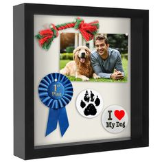 a man and his dog are shown in this shadow box with their pet's paw prints