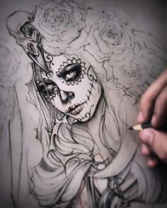 a drawing of a woman with roses on her face and the words day of the dead written in black ink