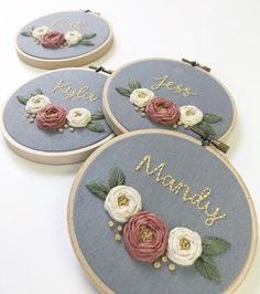 three embroidered hoops with flowers and the words,'just married'on them