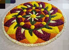 a colorful flower design is displayed on the floor