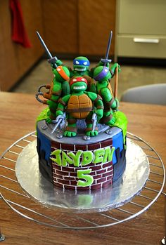 a teenage mutant birthday cake with ninja turtles on top