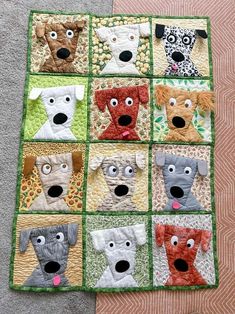 a quilt made to look like dogs with their mouths open and eyes wide, sitting on the floor