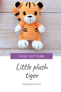 a crocheted tiger stuffed animal sitting on top of a wooden floor with text overlay