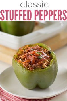 an image of stuffed peppers on a plate with the title in the middle reading classic stuffed peppers