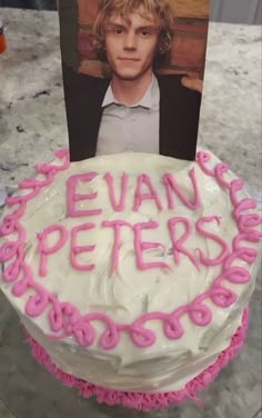 a birthday cake with the name evan peters on it