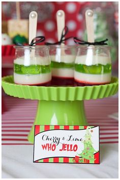 three desserts are on a green plate with red and white striped table cloth in the background