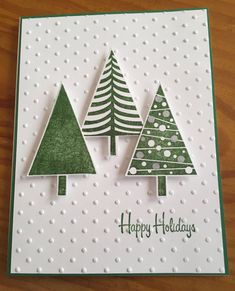 a handmade christmas card with trees on it