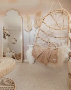 a hammock hanging from the ceiling in a room with mirrors and other furniture