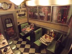 the inside of a restaurant with tables and booths set up for diners to eat