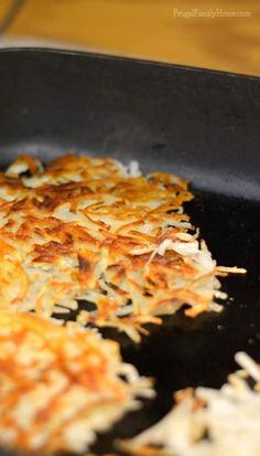 some food is being cooked in a pan on the stove and ready to be eaten